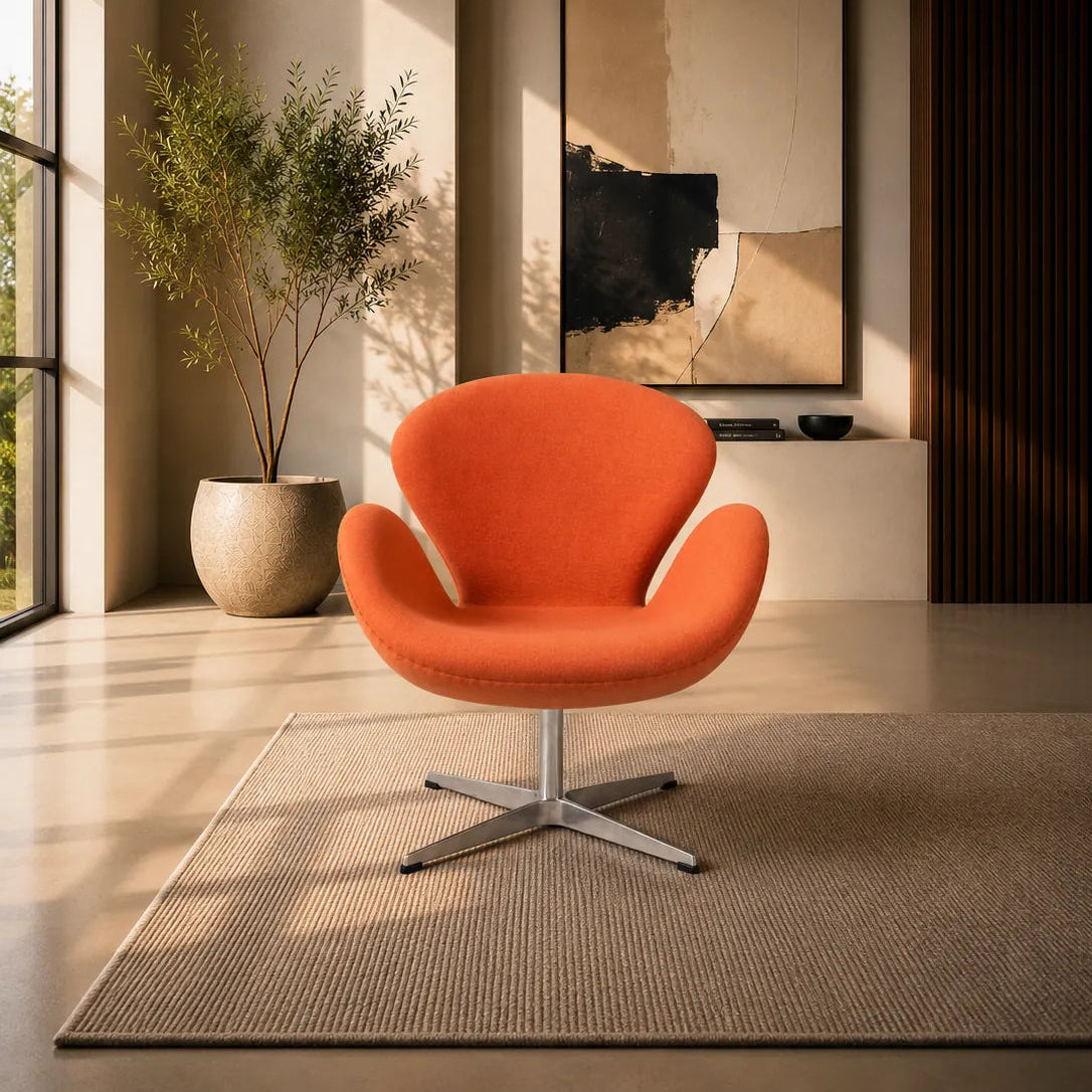 A modern orange upholstered swivel armchair with a chrome four-star base, placed on a textured beige rug in a minimalist, warm-toned interior room with a potted plant and abstract wall art.