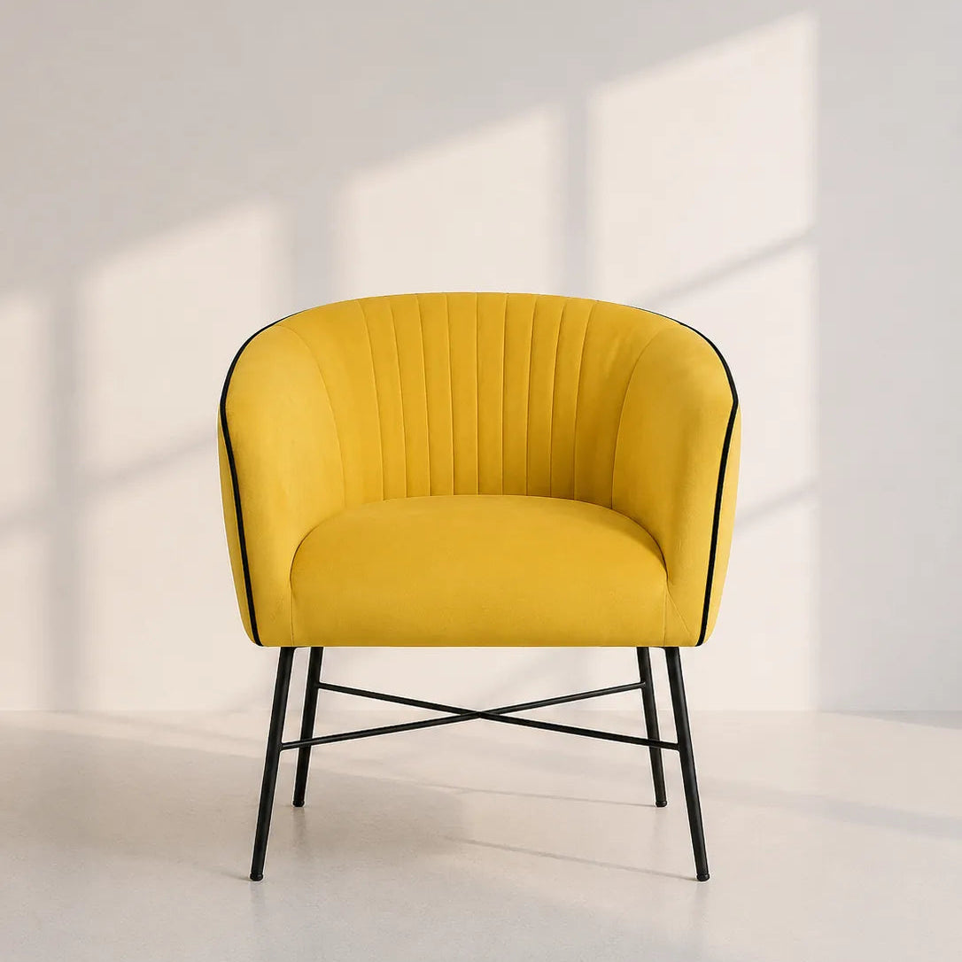 Image of A modern yellow upholstered accent chair with black metal legs, set against a minimalist white wall with soft window shadow patterns.