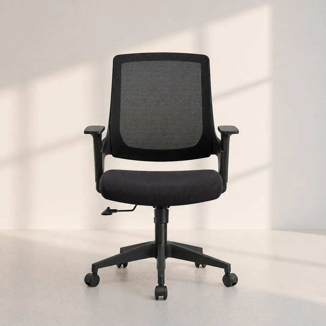 Image of A modern black mesh office chair with adjustable armrests and a five-star wheeled base, positioned in a minimalist room with soft window light casting shadows on the wall.