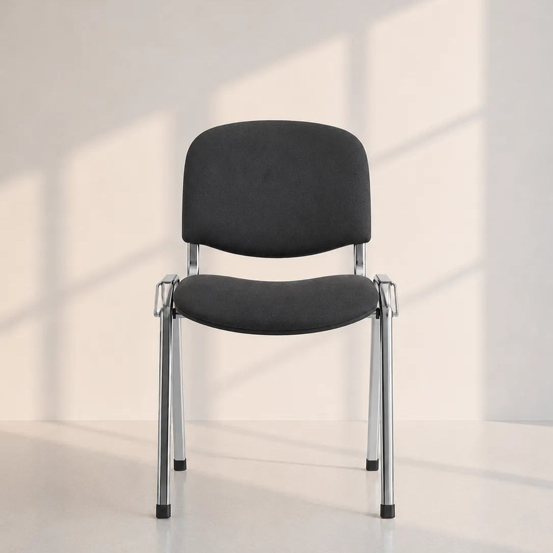 Image of A modern black upholstered chair with a chrome metal frame, positioned in a minimalist room with soft window-box shadows cast on a light beige wall and floor.