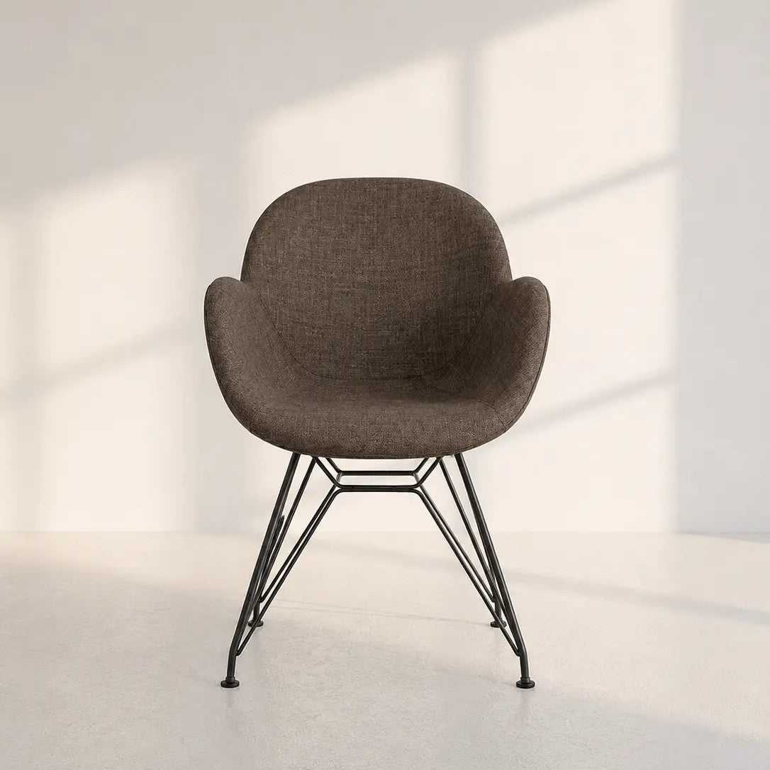 Image of A modern molded seat chair with a textured brown fabric upholstery and black metal wire legs, set against a minimalist white wall with soft window shadow patterns.