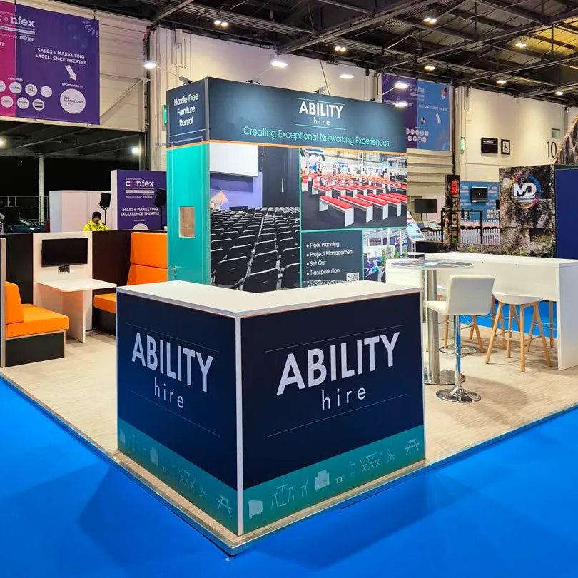 Ability Furniture Hire exhibition stand with branded counters and bar stools