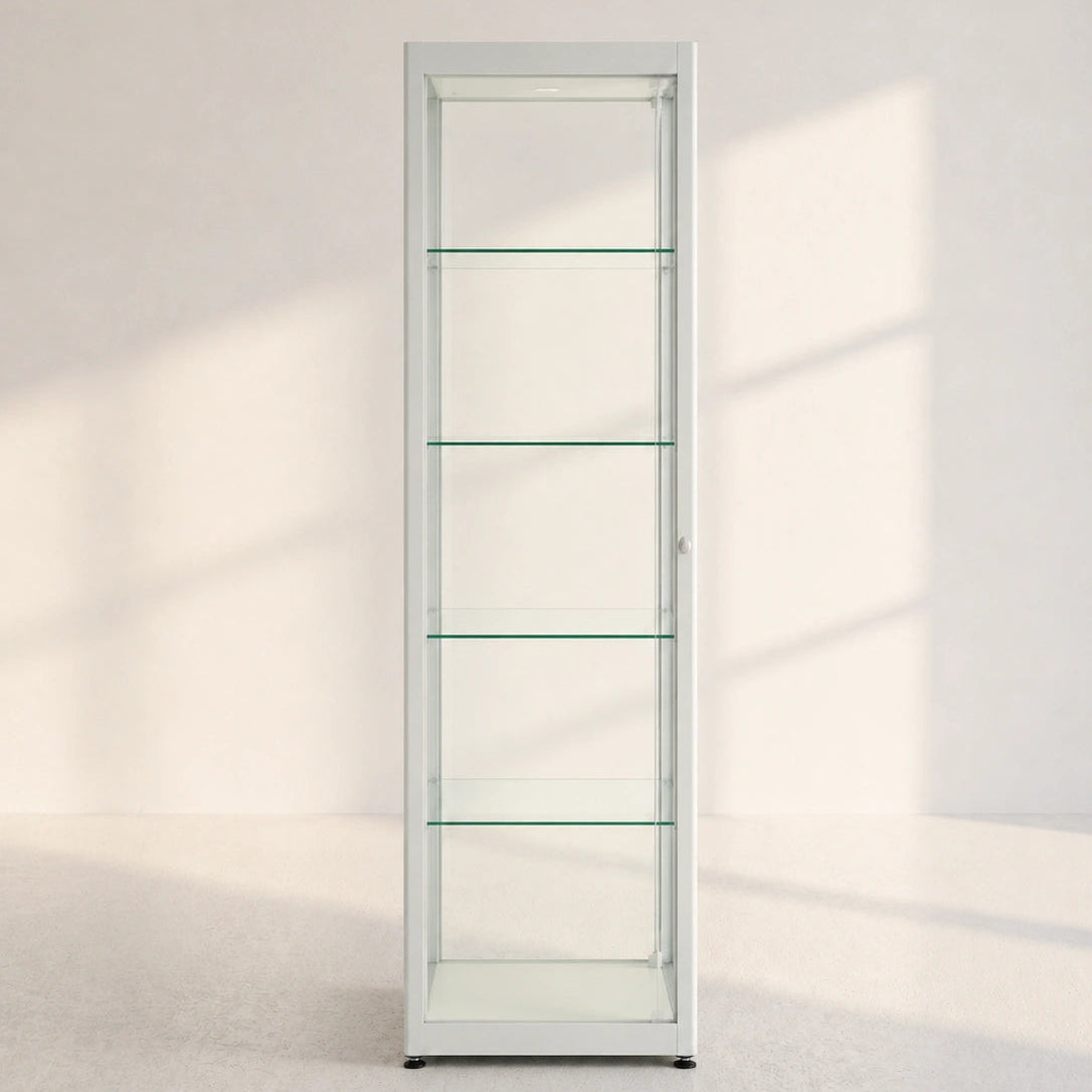Image of A tall, narrow white glass display cabinet with five shelves, shown in a minimalist room with soft window shadows.