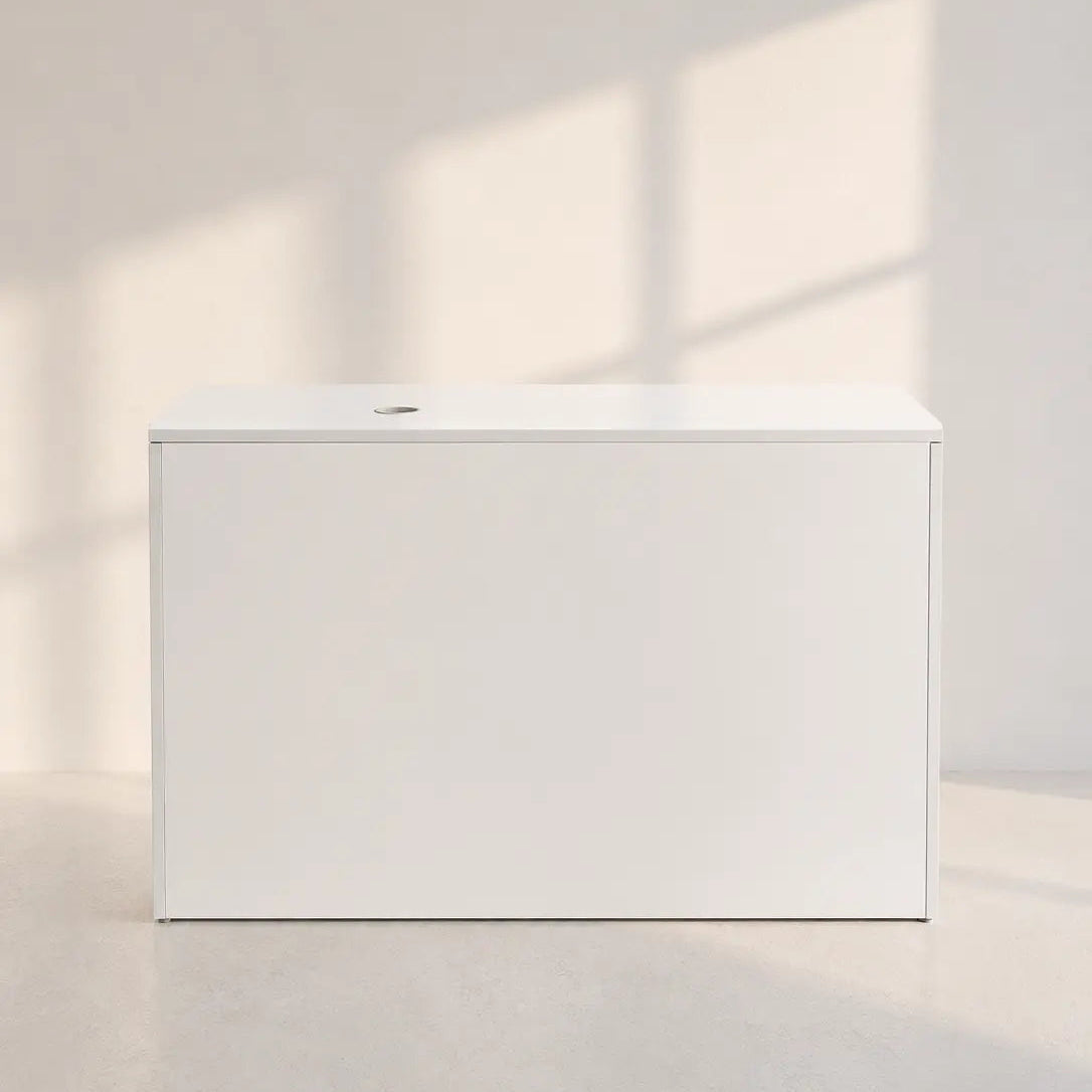 Image of A minimalist white rectangular storage box with a lid, positioned on a light concrete floor against a matching wall with soft window shadow projections.