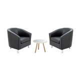 Two grey armchairs with a small white table