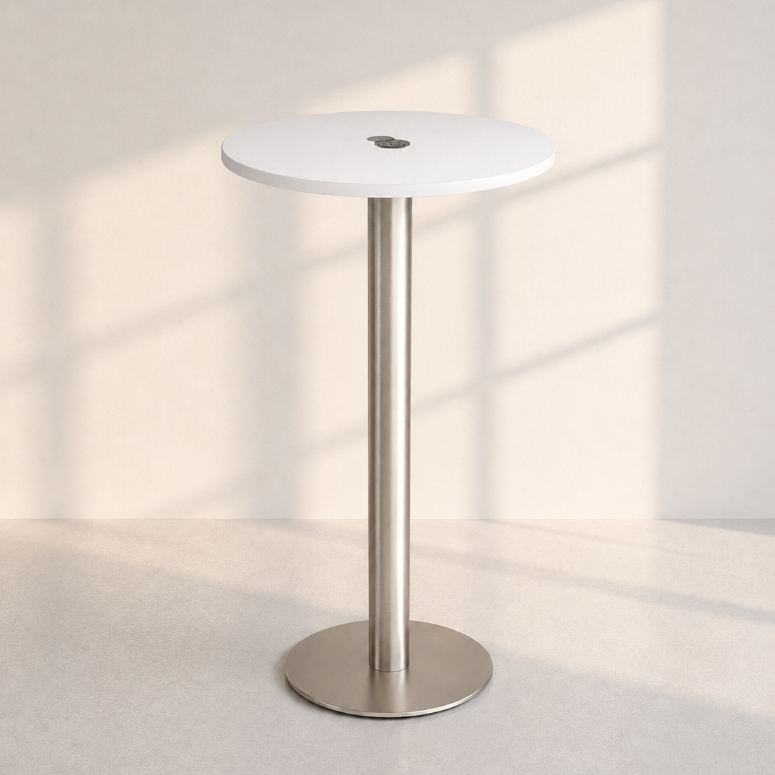 Image of A modern round bar table with a white top and a brushed silver metal pedestal base, set against a minimalist beige wall with soft window shadow patterns.