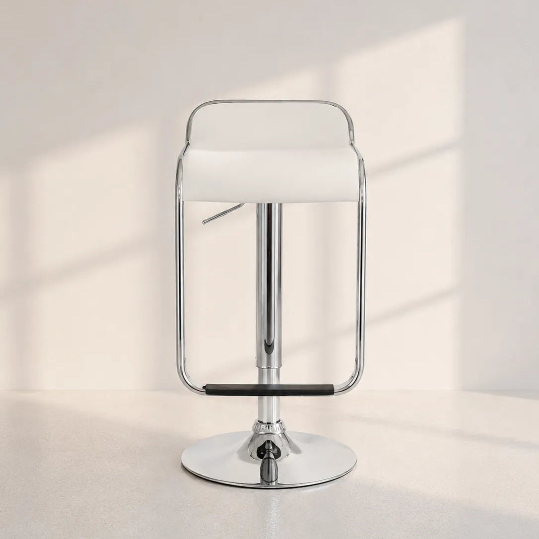 Image of A modern chrome bar stool with a white upholstered seat and a black footrest, set against a minimalist off-white background with soft window shadow patterns.